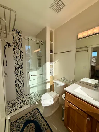 a front view of a house with parking space and a street view