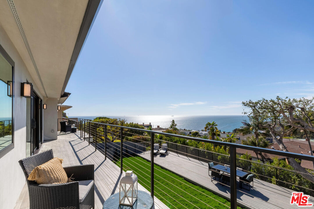 243 Notteargenta Road Pacific Palisades, CA 90272 - Photo 14 of 46 a view of a balcony with chairs