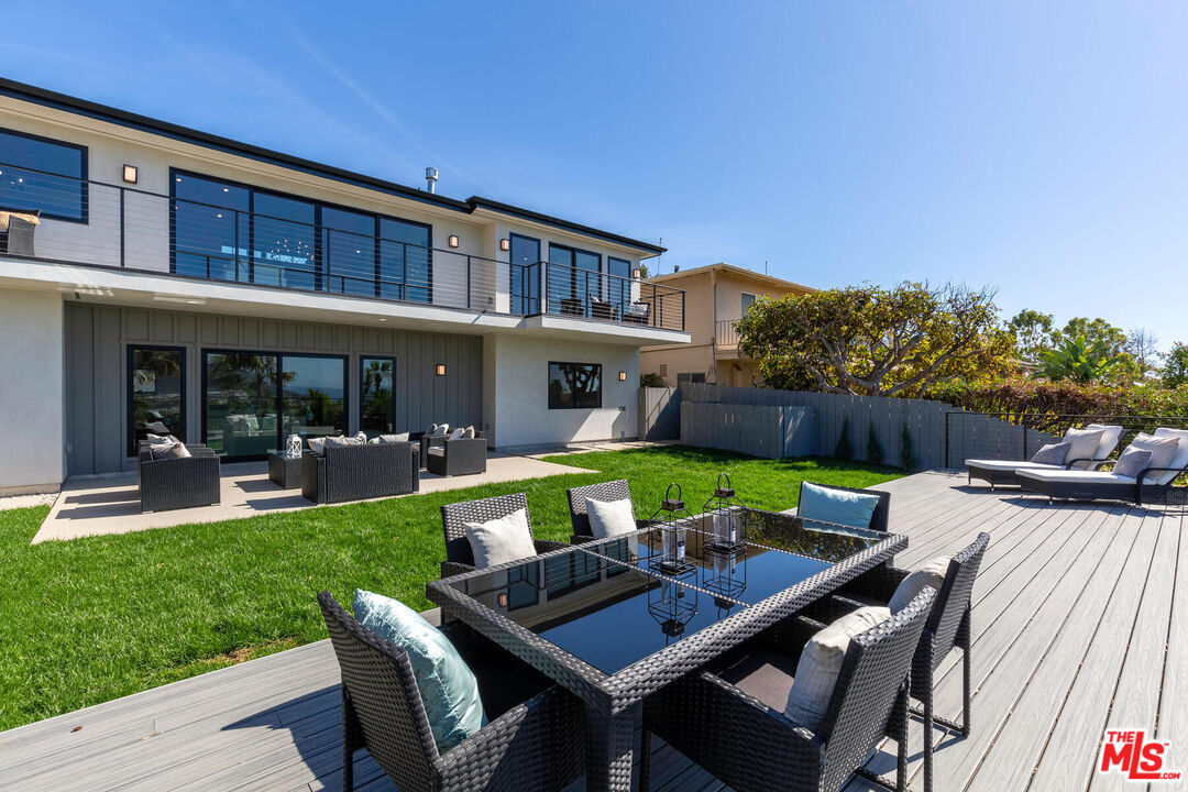 243 Notteargenta Road Pacific Palisades, CA 90272 - Photo 34 of 46 a view of an house with backyard porch and furniture