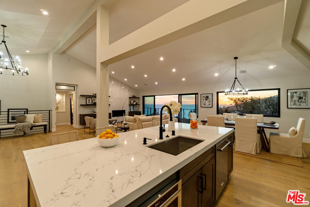 243 Notteargenta Road Pacific Palisades, CA 90272 - Photo 38 of 46 a kitchen with sink and view of living room