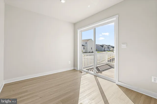 a view of a balcony with wooden floor
