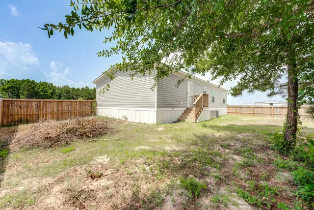 a view of backyard with green space