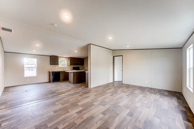 a view of a kitchen with a sink and a stove top oven