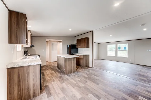 a view of a kitchen with a sink and a window