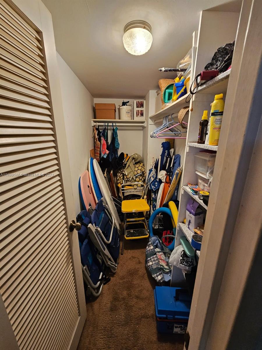 9511 Collins Avenue, Unit 403 Surfside, FL 33154 - Photo 11 of 52 a view of a room with gym equipment