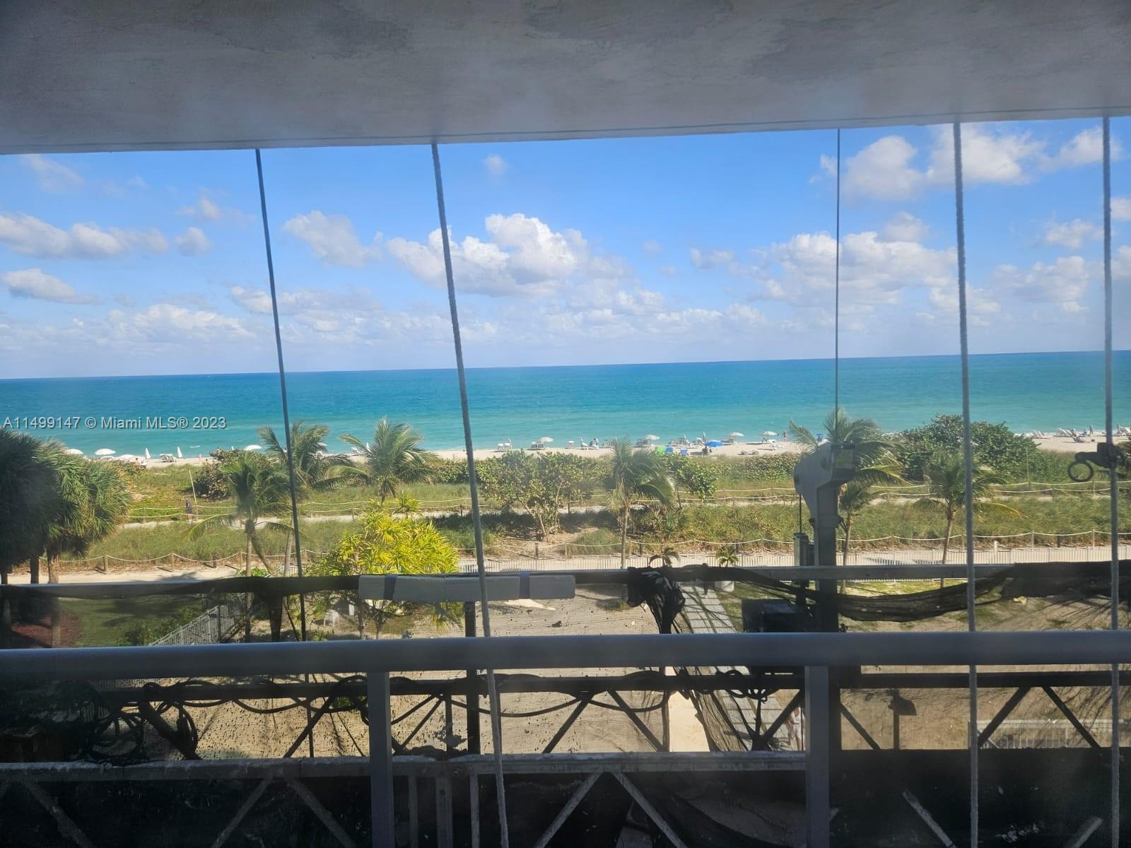 9511 Collins Avenue, Unit 403 Surfside, FL 33154 - Photo 23 of 52 a view of a swimming pool with outdoor seating