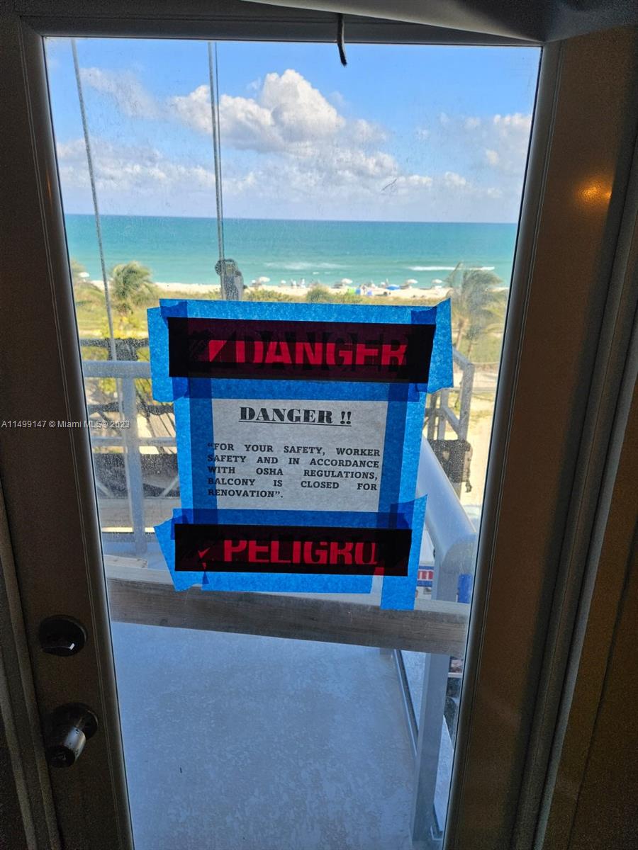9511 Collins Avenue, Unit 403 Surfside, FL 33154 - Photo 24 of 52 a sign on the side of a building