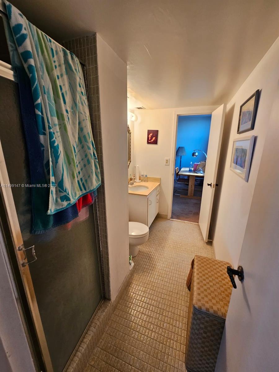 9511 Collins Avenue, Unit 403 Surfside, FL 33154 - Photo 35 of 52 a living room with furniture and a rug