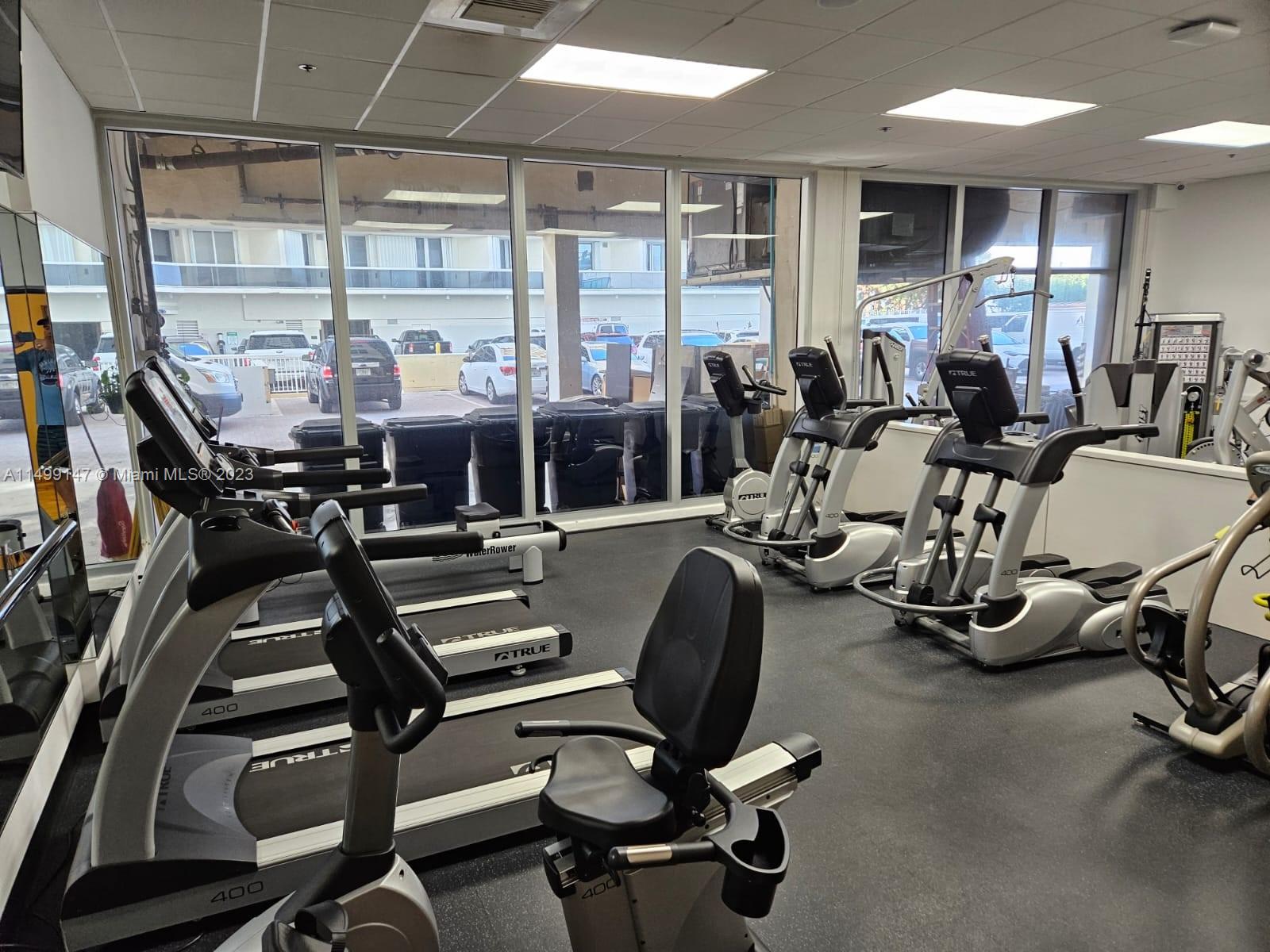 9511 Collins Avenue, Unit 403 Surfside, FL 33154 - Photo 45 of 52 a view of a room with gym equipment