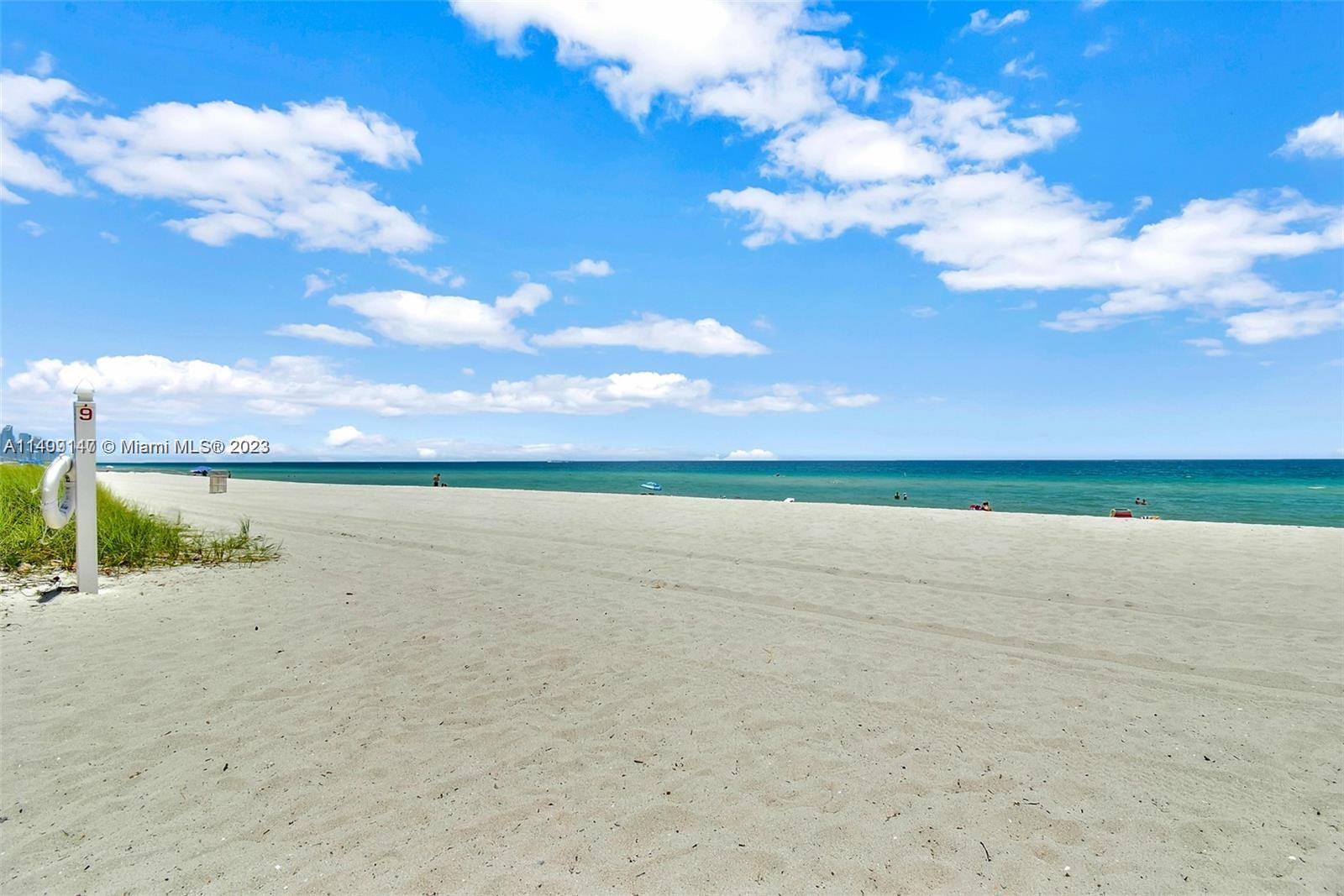9511 Collins Avenue, Unit 403 Surfside, FL 33154 - Photo 49 of 52 a view of an ocean and beach