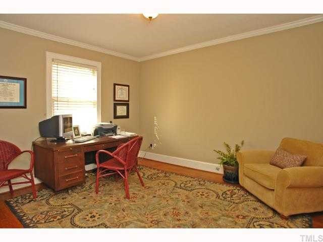 215 Glascock Street Raleigh, NC 27604 - Photo 10 of 12 This center bedroom is used as an office but can easily make a great bedroom with spacious closet space! Hardwood floors in all bedrooms is great for people with allergies! Bedroom