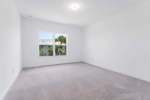 a view of empty room with white walls