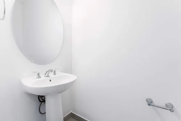 a bathroom with a double vanity sink toilet and a mirror