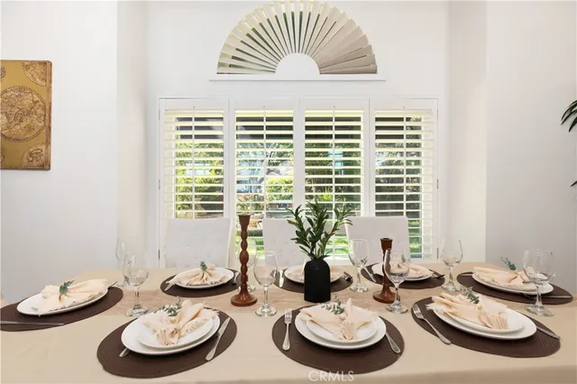 a view of a dining room with furniture and a table