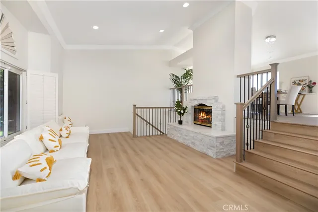 a bedroom with furniture and a potted plant