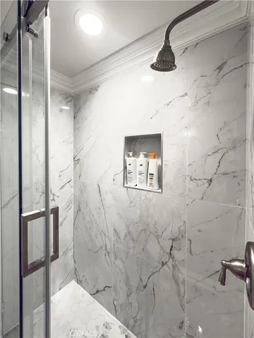 a bathroom with a granite countertop toilet sink and mirror