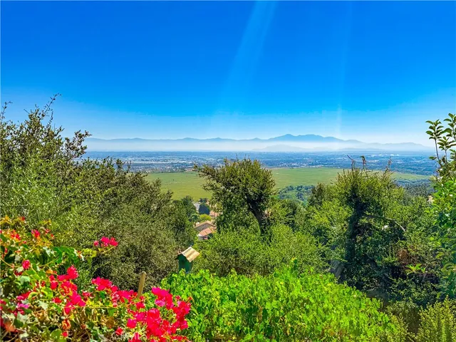 a view of a chair and table on the deck