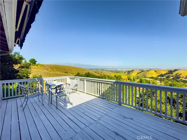 a view of balcony with wooden floor