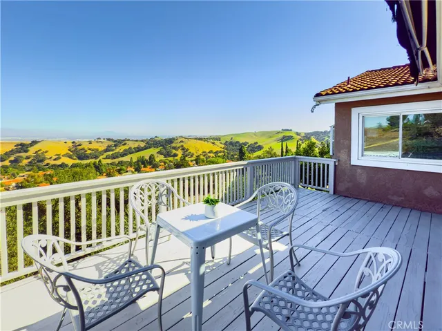 a view of a porch with wooden floor
