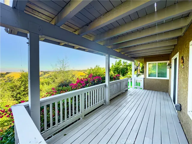 a view of a yard with wooden fence