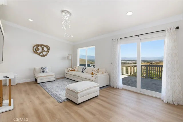 a spacious bedroom with a bed and glass door