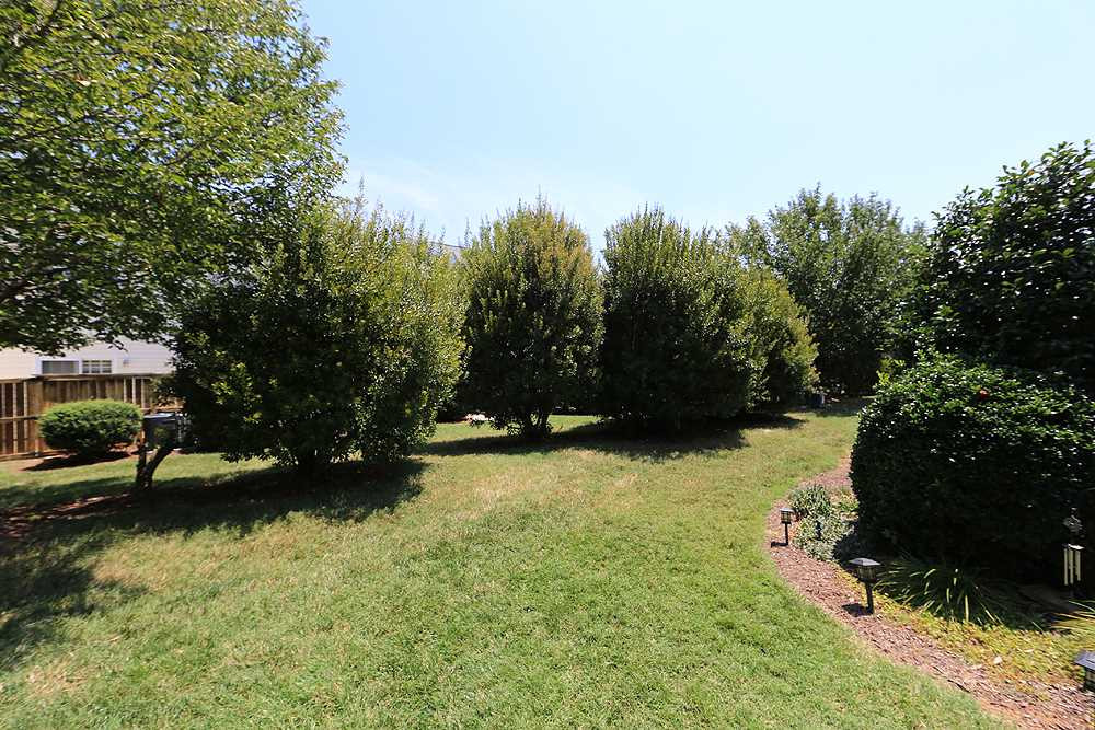 2041 Rivergate Road, Unit 103 Raleigh, NC 27614 - Photo 17 of 21 Breezewood's well-planned community offers privacy and greenery year-round with this natural buffer Exterior Back
