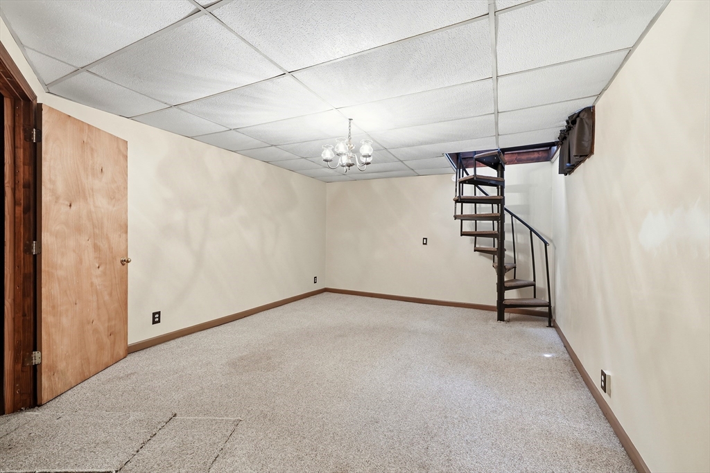 19-21 Wedgewood Circle Springfield, MA 01129 - Photo 29 of 32 a view of a hallway with a chandelier