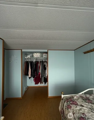 a bedroom with a bed and a walk in closet