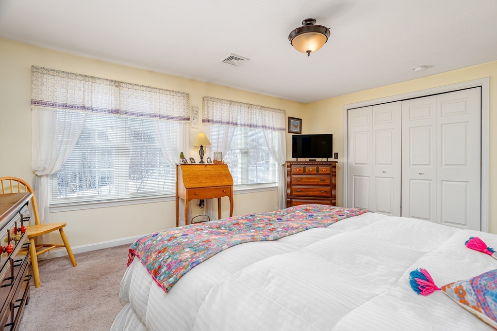 101 Bridle Cross Road, Unit 101 Fitchburg, MA 01420 - Photo 17 of 26 a bedroom with a bed and a window