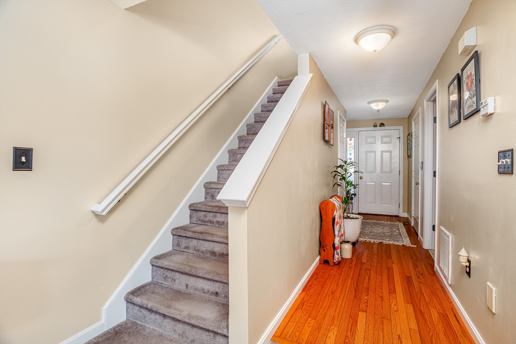101 Bridle Cross Road, Unit 101 Fitchburg, MA 01420 - Photo 3 of 26 a view of entryway and hall with wooden floor