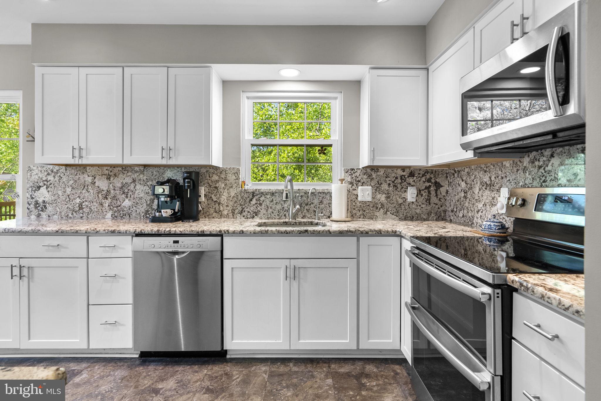 3128 Memory Lane Silver Spring, MD 20904 - Photo 11 of 49 Renovated Kitchen with white shaker cabinets.