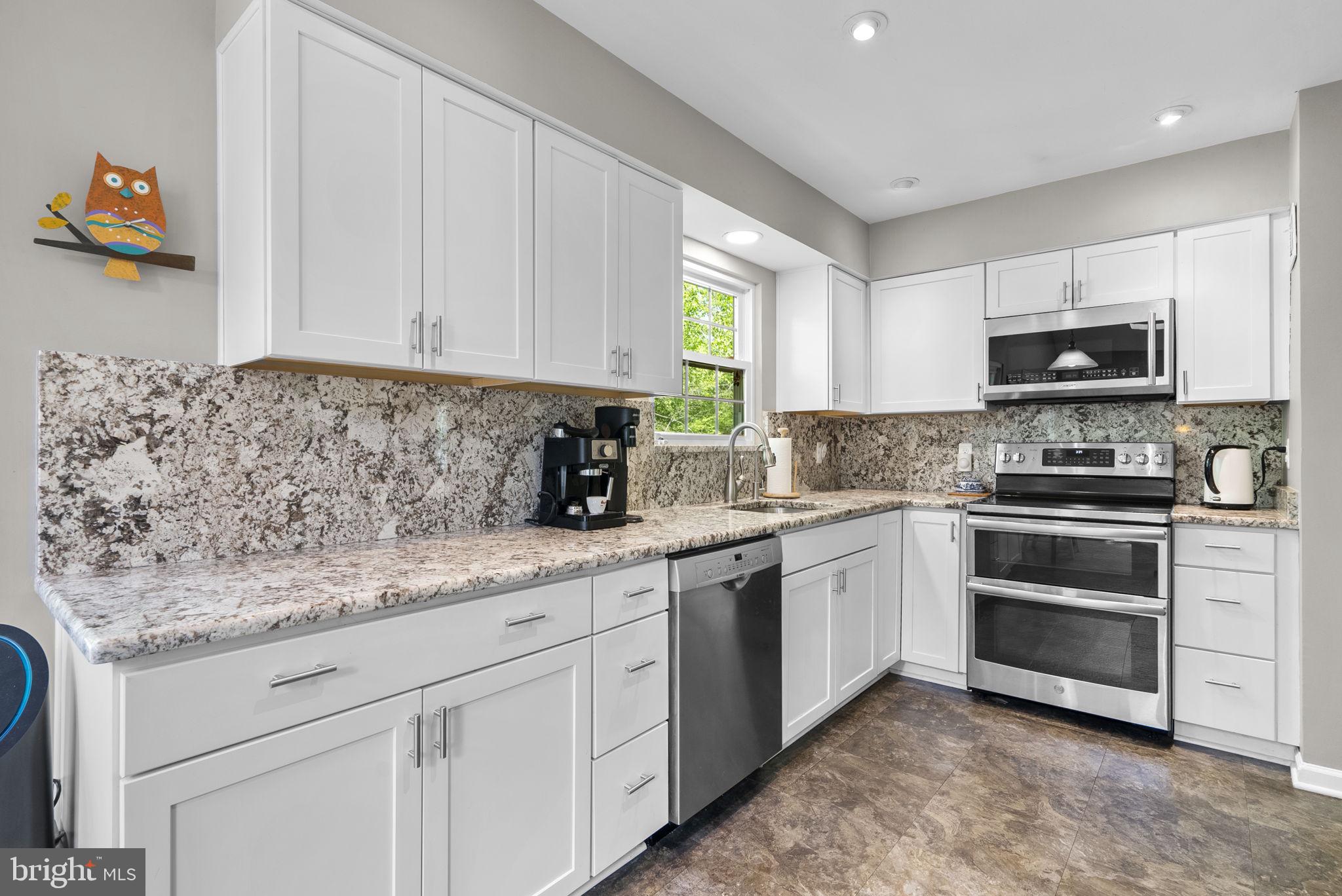3128 Memory Lane Silver Spring, MD 20904 - Photo 13 of 49 Modern with granite countertops and backsplash.