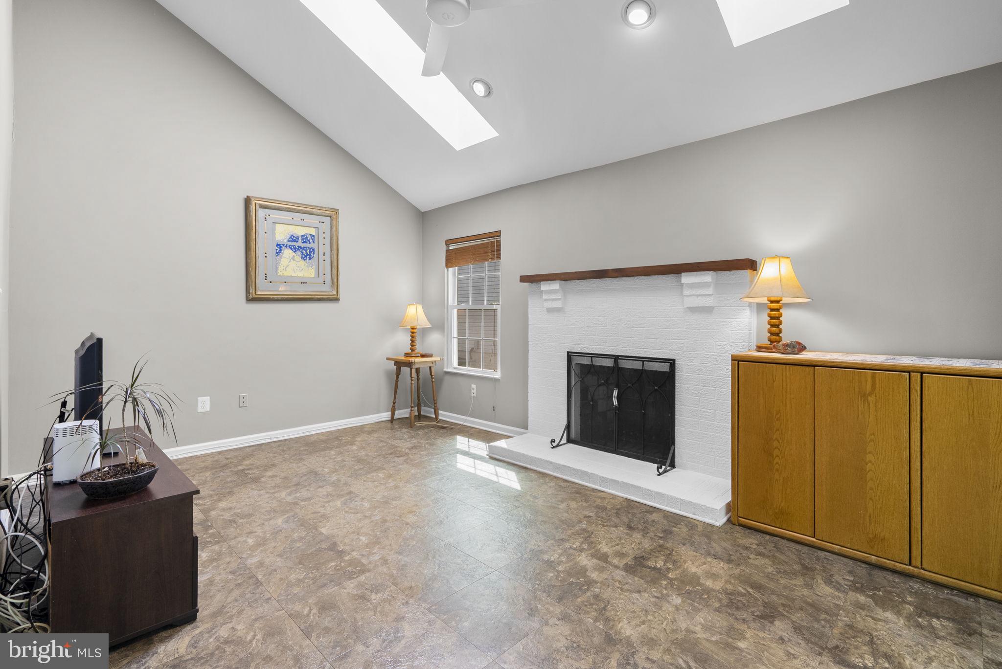 3128 Memory Lane Silver Spring, MD 20904 - Photo 15 of 49 Family Room with skylights and wood fireplace.