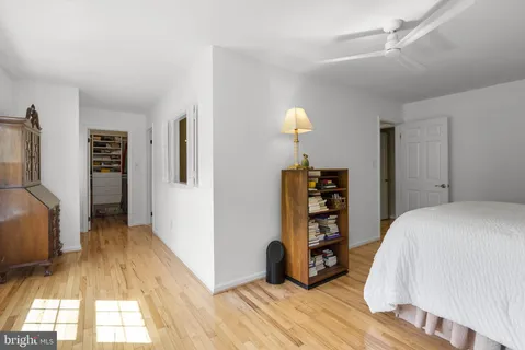 a room with a bed furniture and a window