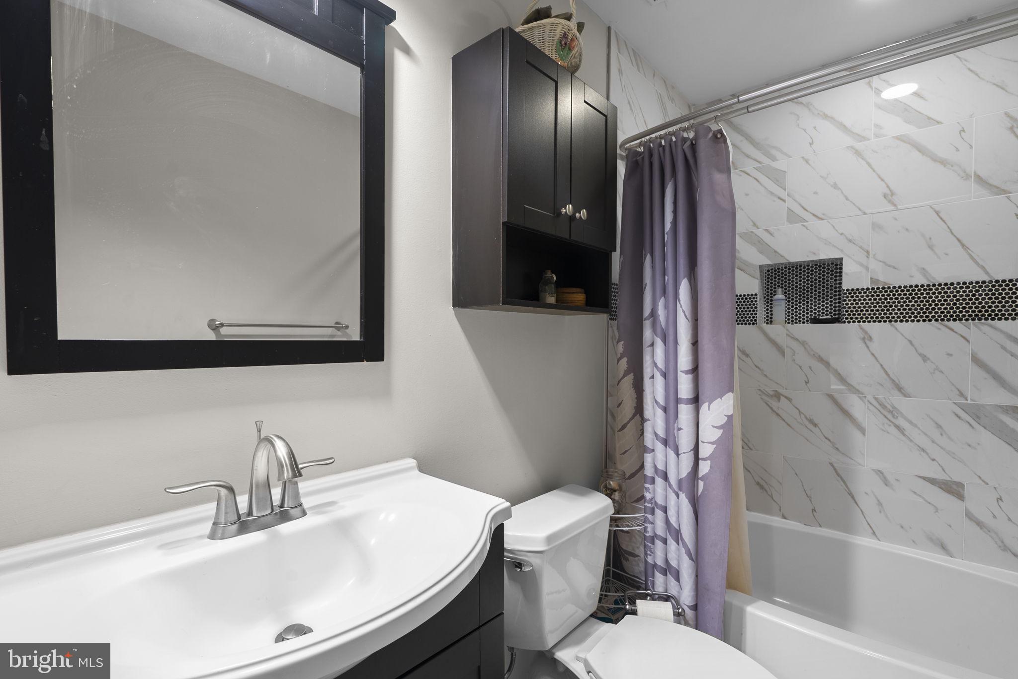 3128 Memory Lane Silver Spring, MD 20904 - Photo 29 of 49 Renovated upper level full bath with tub/shower.