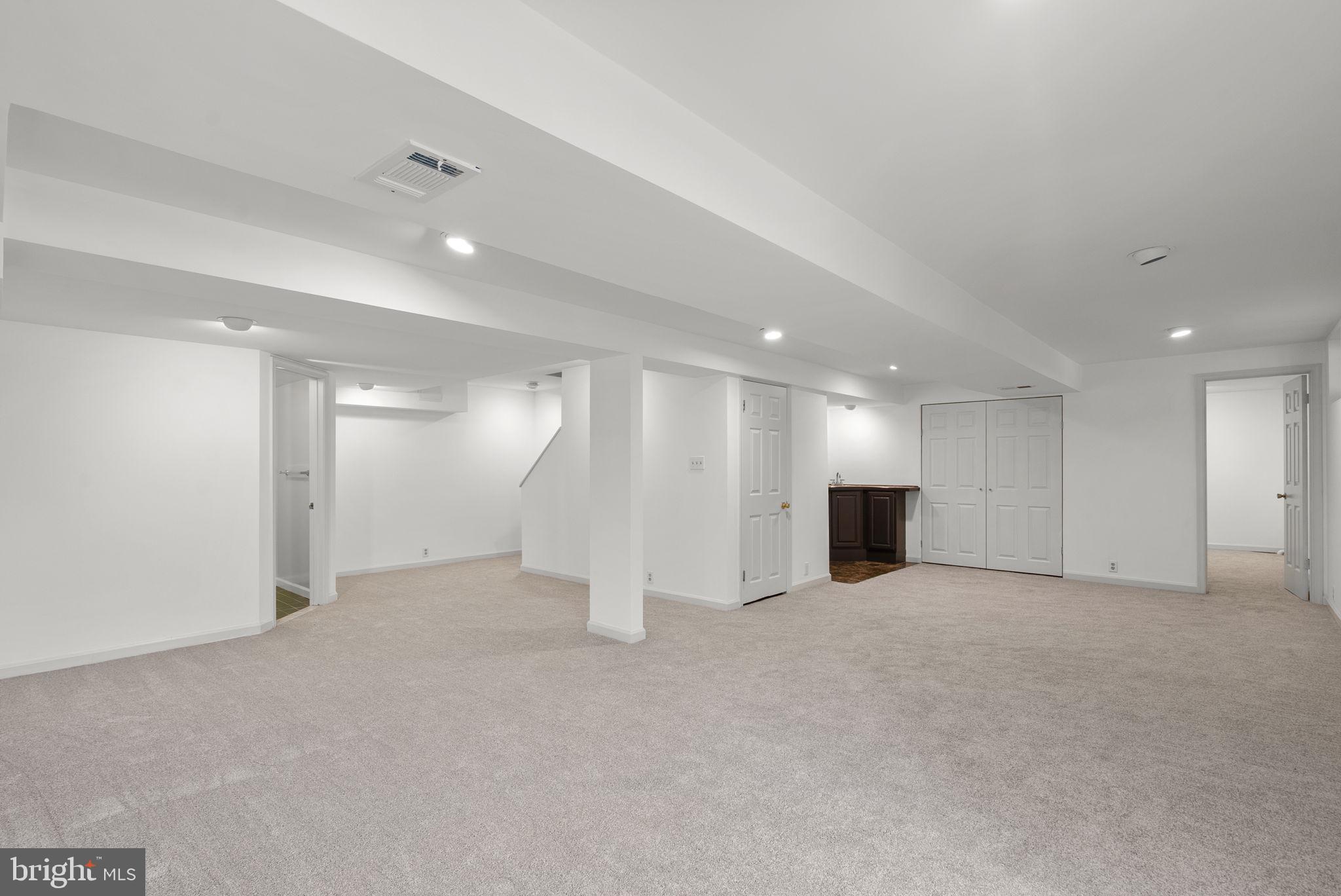 3128 Memory Lane Silver Spring, MD 20904 - Photo 36 of 49 Spacious, walk-out family room with new carpet.