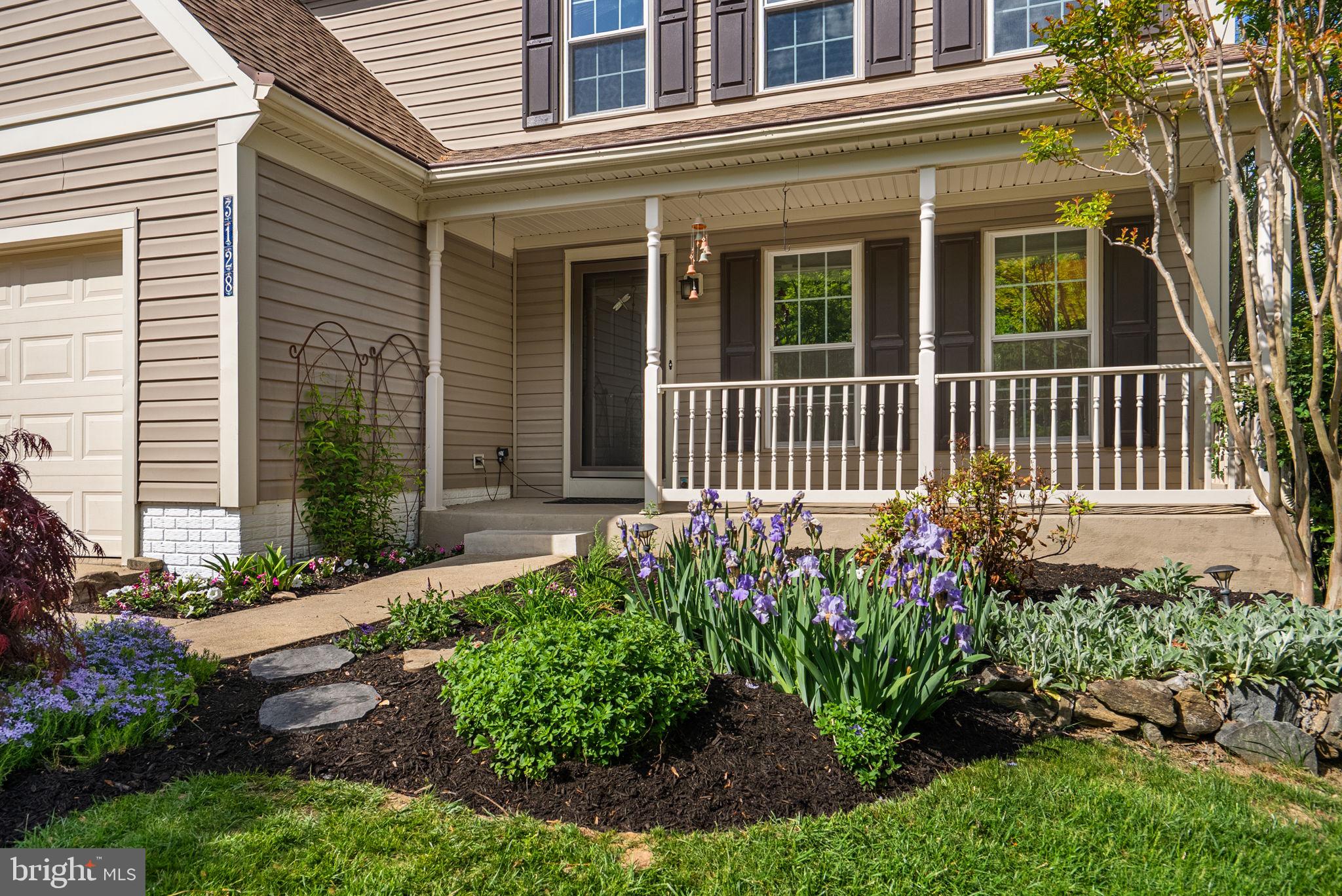 3128 Memory Lane Silver Spring, MD 20904 - Photo 4 of 49 Front porch with vibrant blooms.