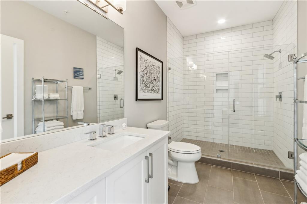 22 Airline Street Southeast, Unit 204 Atlanta, GA 30312 - Photo 17 of 34 a bathroom with a sink toilet and shower