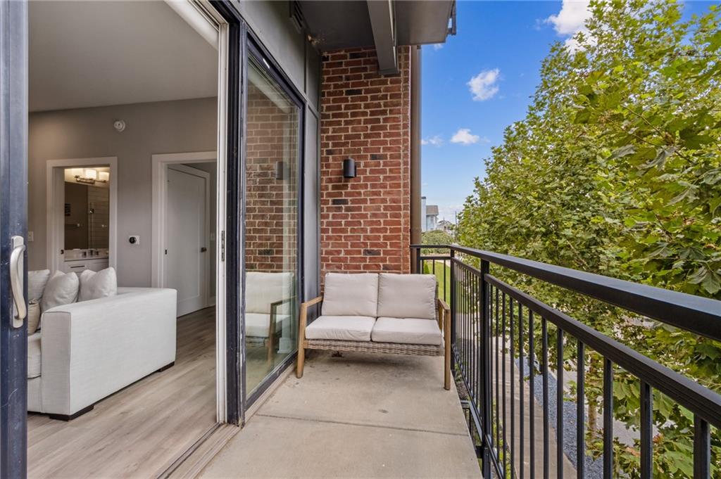 22 Airline Street Southeast, Unit 204 Atlanta, GA 30312 - Photo 22 of 34 a balcony with couch and white walls