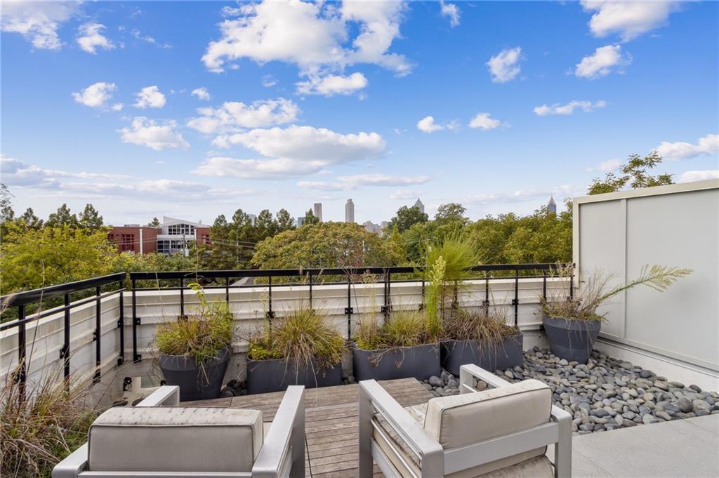 22 Airline Street Southeast, Unit 204 Atlanta, GA 30312 - Photo 25 of 34 a view of a patio with couches and city view