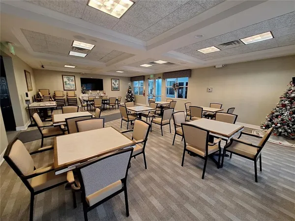 a living room with furniture a rug and a flat screen tv