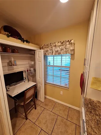 a workspace with furniture and window