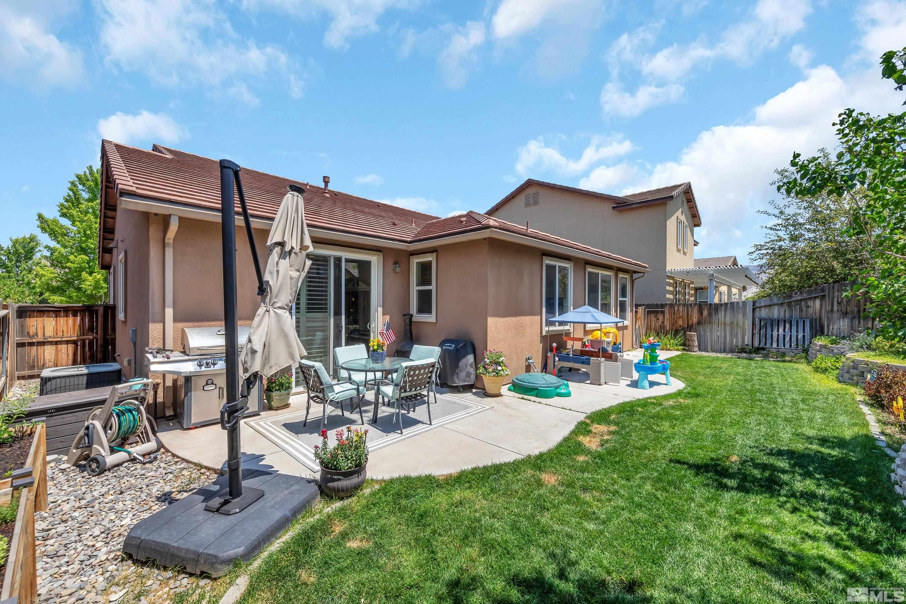 2100 Angel Ridge Drive Reno, NV 89521 - Photo 18 of 35 a view of a house with backyard porch and sitting area