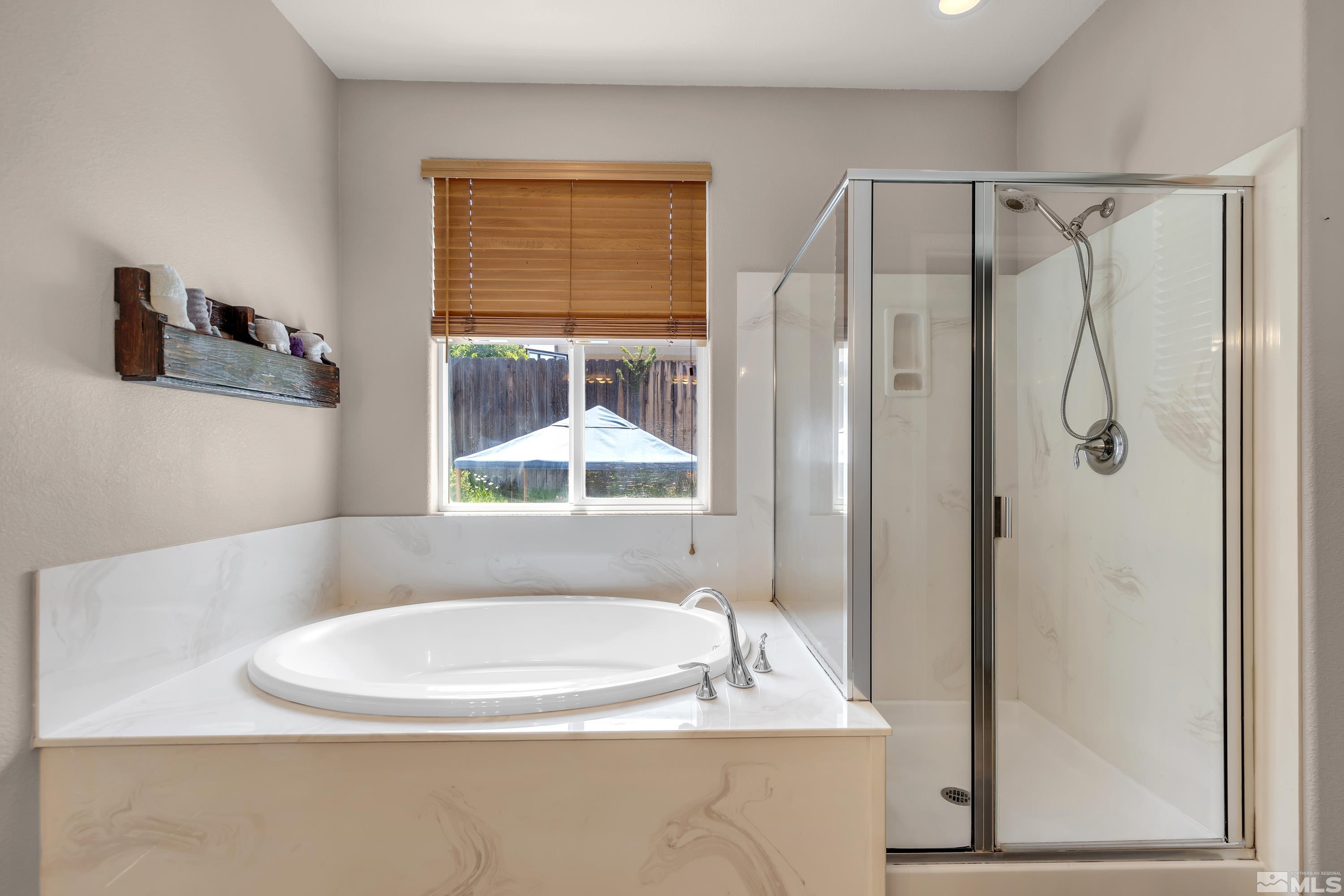 2100 Angel Ridge Drive Reno, NV 89521 - Photo 21 of 35 a bathroom with a bathtub and a shower