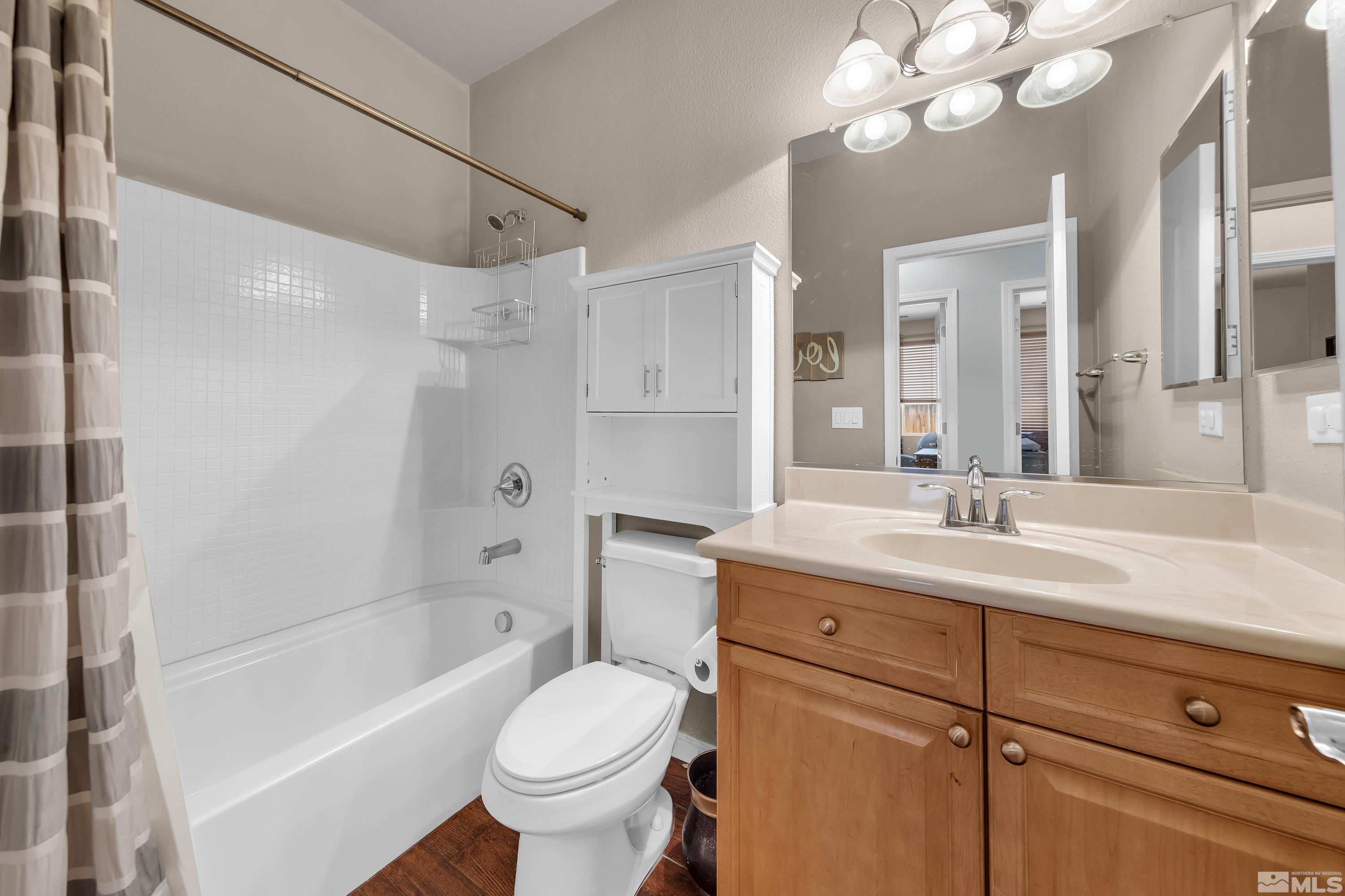 2100 Angel Ridge Drive Reno, NV 89521 - Photo 23 of 35 a bathroom with a sink a toilet and a bathtub