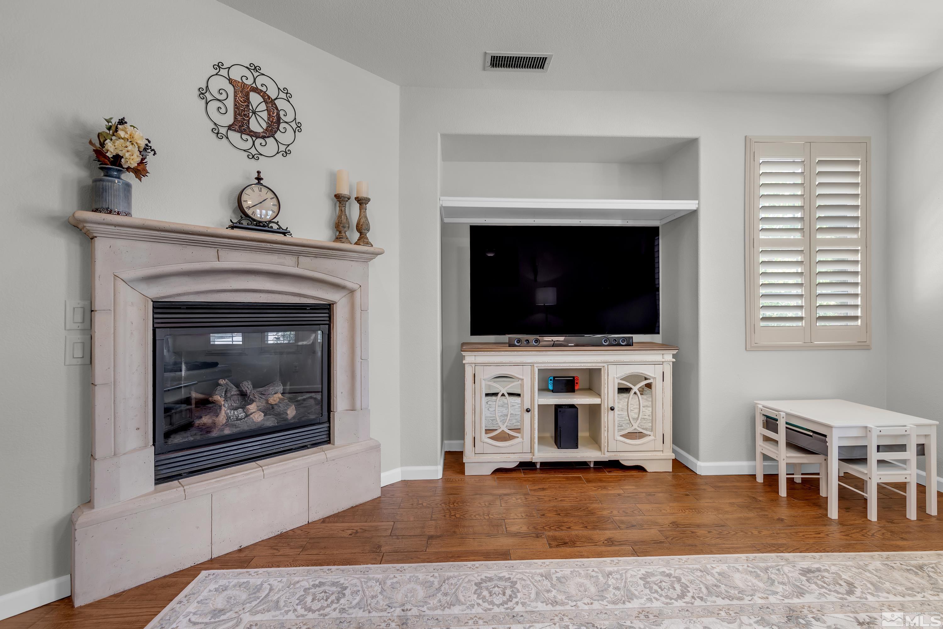 2100 Angel Ridge Drive Reno, NV 89521 - Photo 24 of 35 a living room with flat screen tv and a fireplace