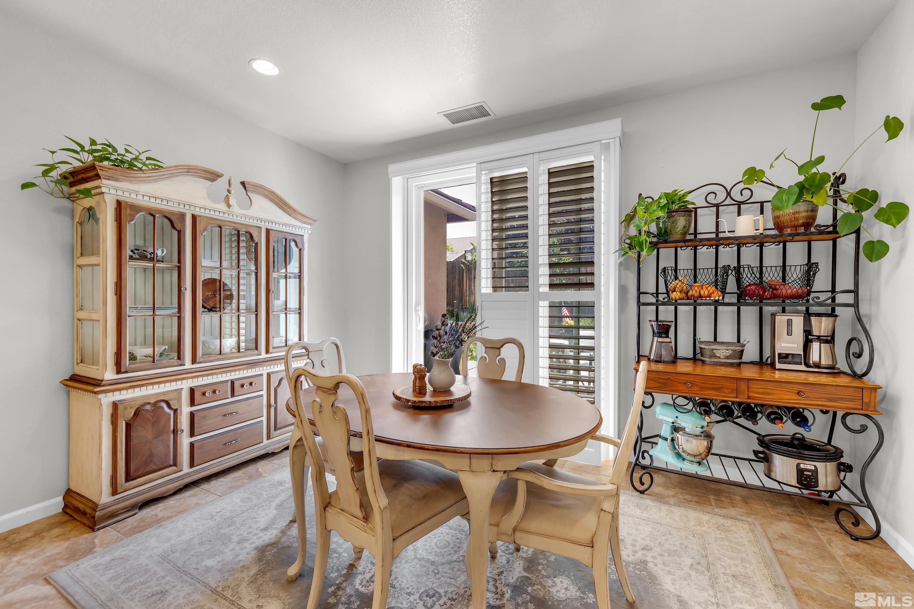 2100 Angel Ridge Drive Reno, NV 89521 - Photo 27 of 35 a dining room with furniture window and wooden floor