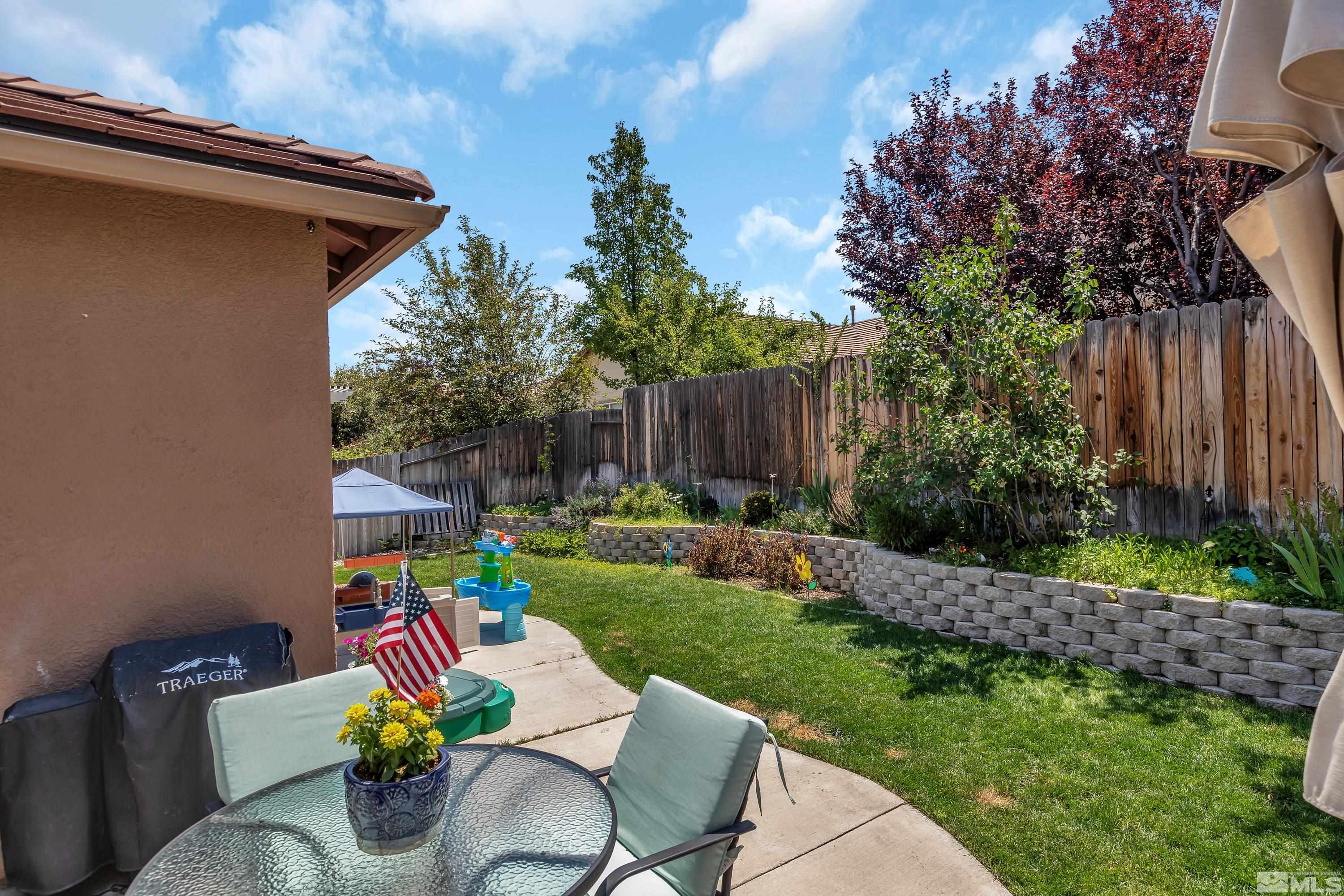 2100 Angel Ridge Drive Reno, NV 89521 - Photo 29 of 35 a view of backyard with furniture and trees