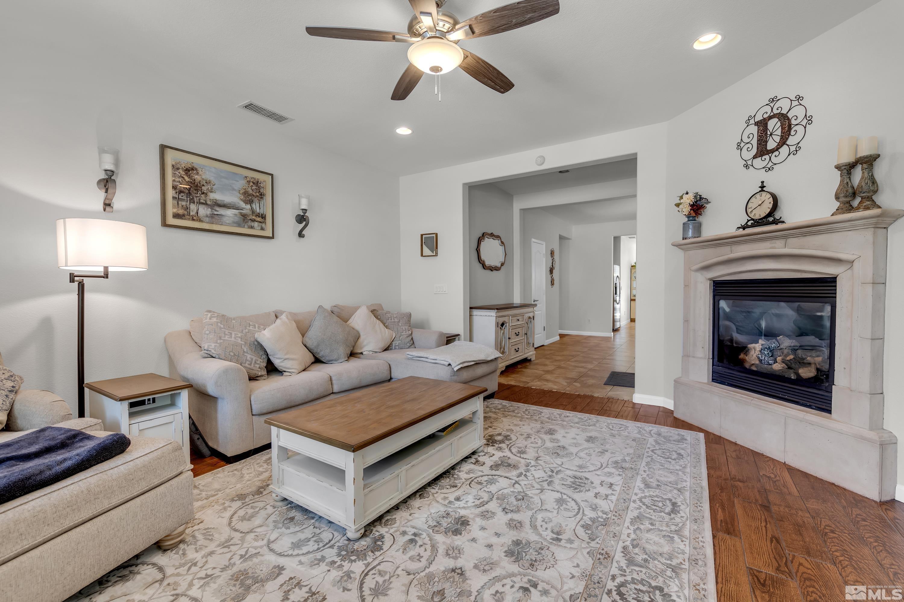 2100 Angel Ridge Drive Reno, NV 89521 - Photo 3 of 35 a living room with furniture and a fireplace