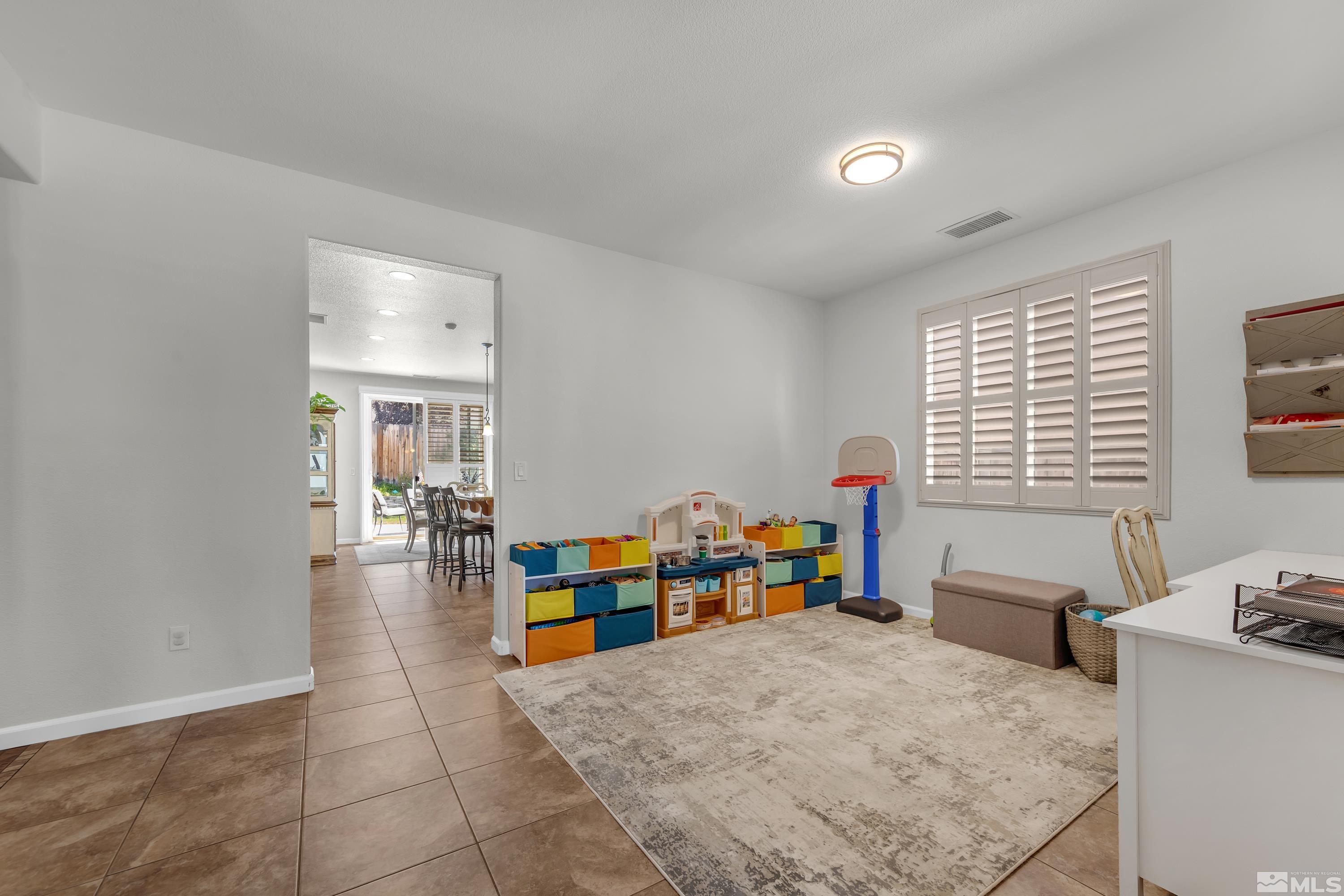 2100 Angel Ridge Drive Reno, NV 89521 - Photo 31 of 35 a bed room with furniture and a window